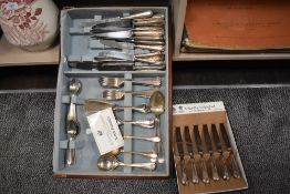 A selection of plated cutlery including Arthur Price knife set.
