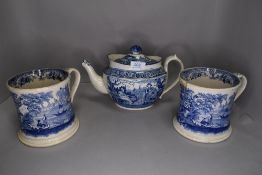 Two large cups(approximately pint cups)and a tea pot, having blue and white classical transfer