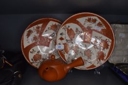 Two Japanese satsuma palette plates and a terracotta tea pot