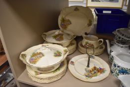 A collection of vintage tureens, plates and more having country cottage transfer pattern to cream