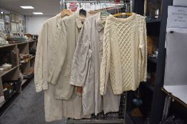 Three gents vintage macs or overcoats and a cable knit cream jumper.