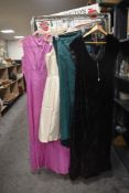 A variety of 1950s and 60s dresses and gowns, mixed styles, some with labels such as Harvey