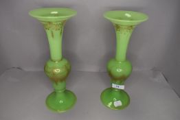 A pair of Bohemian green glass mantle vase having gilt decoration