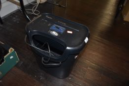 A modern Fellowes office paper shredder