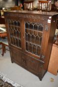 A Jaycee oak display case with under cupboard