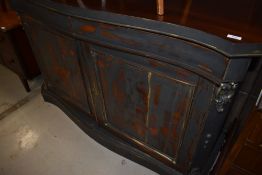 A 19th Century mahogany serpentine front chiffonier having later painted and distressed front