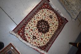 A Persian rug, approx. 75 x 55cm