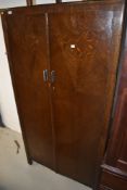 A 1930's oak Fitbrobe compactum wardrobe, reg des 796632, w 90cm