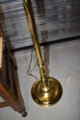 A modern brass effect standard lamp