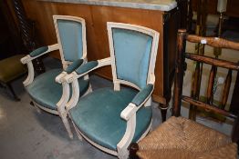 A pair of modern shabby chiq French style salon chairs