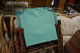 A selection of folding canvas chairs and spares, military/campaign style