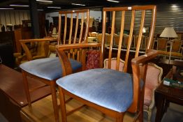 A pair of vintage teak frame railback carver chairs