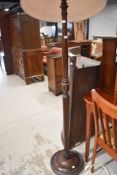 A traditional turned frame standard lamp