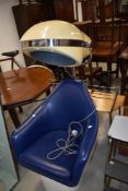 A vintage commercial style hairdryer having blue vinyl seat