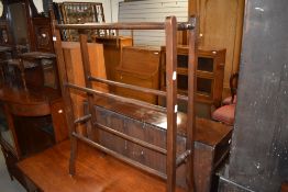 A Victorian mahogany towel rail having part turned frame