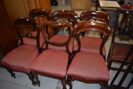 A harlequin set of six mahogany balloon back dining chairs