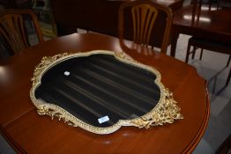 A metal framed classical styled mirror with gilt edge