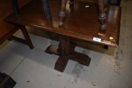 An early to mid 20th Century stained frame occasional /coffee table on gothic style column base,
