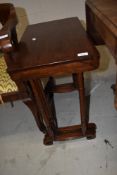 A rosewood nest of three table having fine turned legs