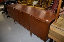 A vintage teak sideboard, McIntosh Dunvegan, having triple cupboard and three drawer section,