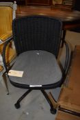 A modern rattan effect swivel office armchair- perfect seating for those home Zoom Cheese and wine