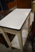 A vintage kitchen work station or prep table