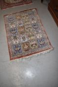 A Persian rug, approx. 75 x 55cm