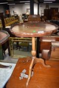 A beech framed three footed side table