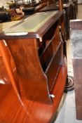 A modern mahogany framed and leather topped magazine holder
