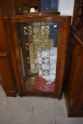 A mid 20th Century walnut china cabinet (key inlcuded)