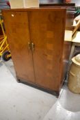 An early to mid 20th Century walnut tallboy