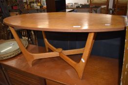 A vintage stylised oval top coffee table