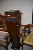 A late Victorian Torchere stand of tapered form with concealed compartment