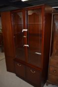 Three modern mahogany effect display cabinet/lounge units