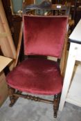 A late Victorian rocking chair in a small size having upholstered seat