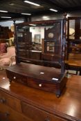 A 19th Century mahogany toilet mirror having drawer base