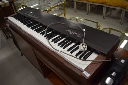 A Yamaha PF15 digital piano