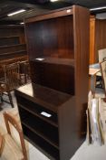 A late 20th century sapele 2 piece adjustable bookshelf unit