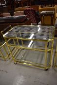 A high quality brass and glass serving trolley