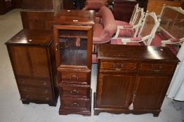 Three reproduction cupboards including slim line glazed fronted, side board style and false fronted