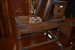 An oak framed telephone table with lift lid storage