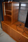 A selection of vintage teak effect entertainment cabinets