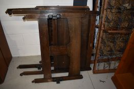 A 1920's oak frame single bedstead having Staples and Co iron base