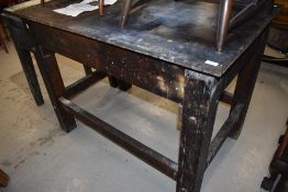 A large industrial printers block table having cast iron top, would make a fabulous kitchen island