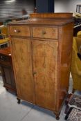 An early 20th Century walnut tallboy