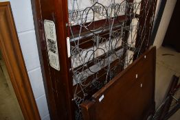 A 1920's oak single bedstead having Staples patent base
