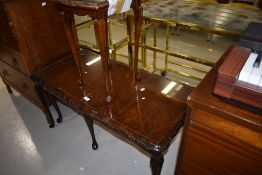 A period style coffee table with one nesting table under and another stand alone occasional table