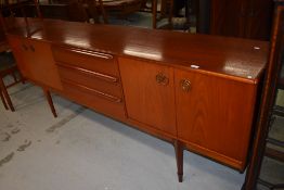A mid century teak long side board and cupboard unit by McIntosh