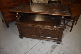A traditional oak monks bench having lion supports