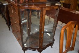 An art deco display case with mirror back